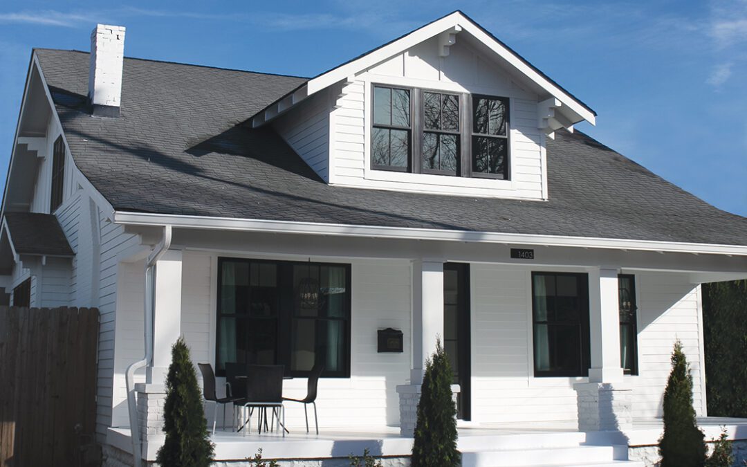 A home with new LP SmartSide trim and siding in bright white with black trim