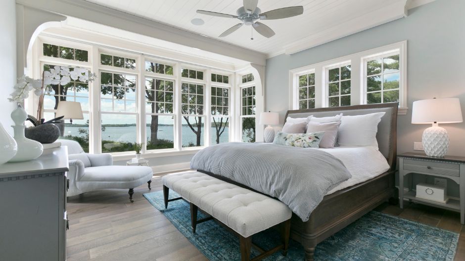 White energy-efficient windows installed in a remodeled bedroom